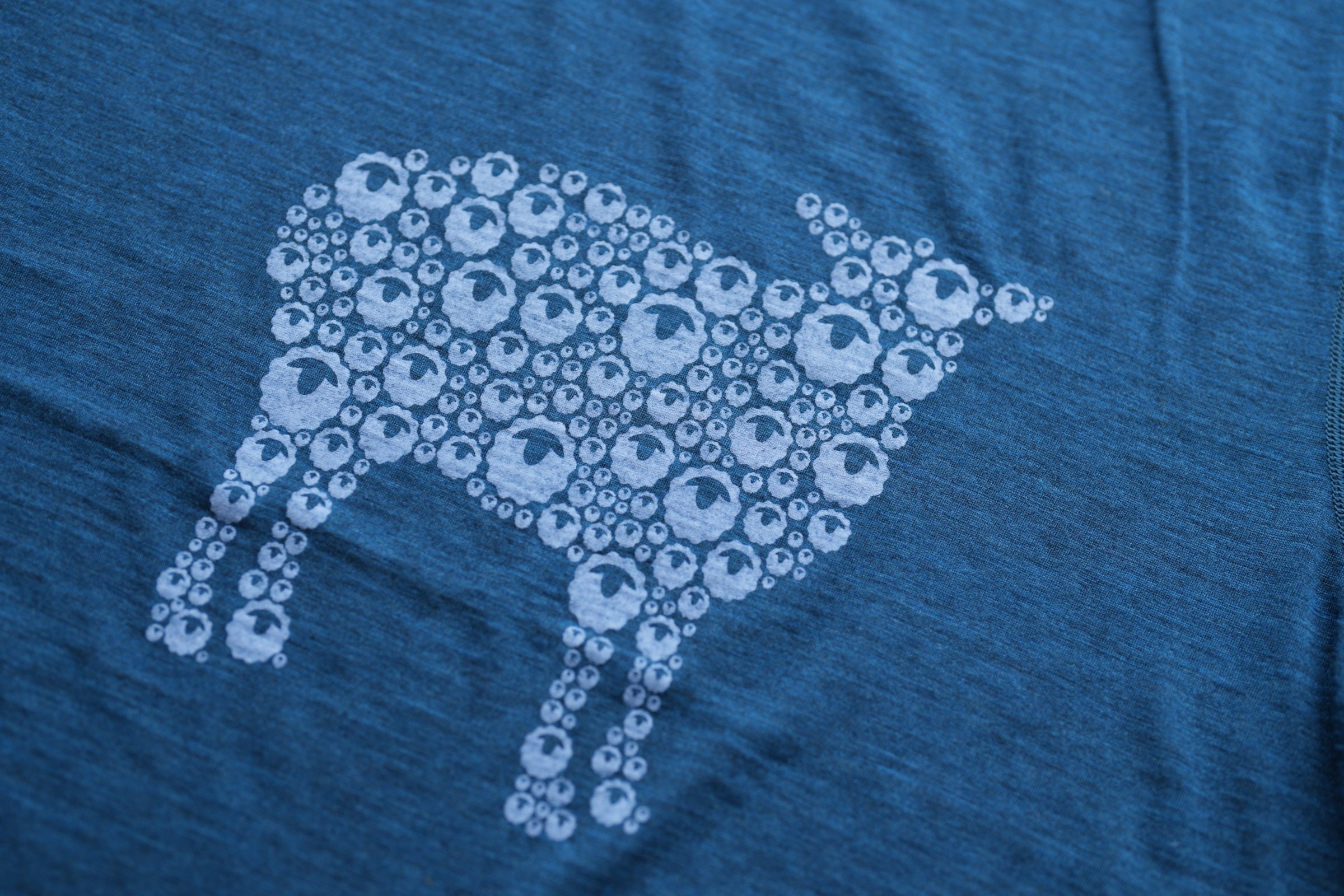 A merino wool t-shirt with a sheep design made of Isobaa icons