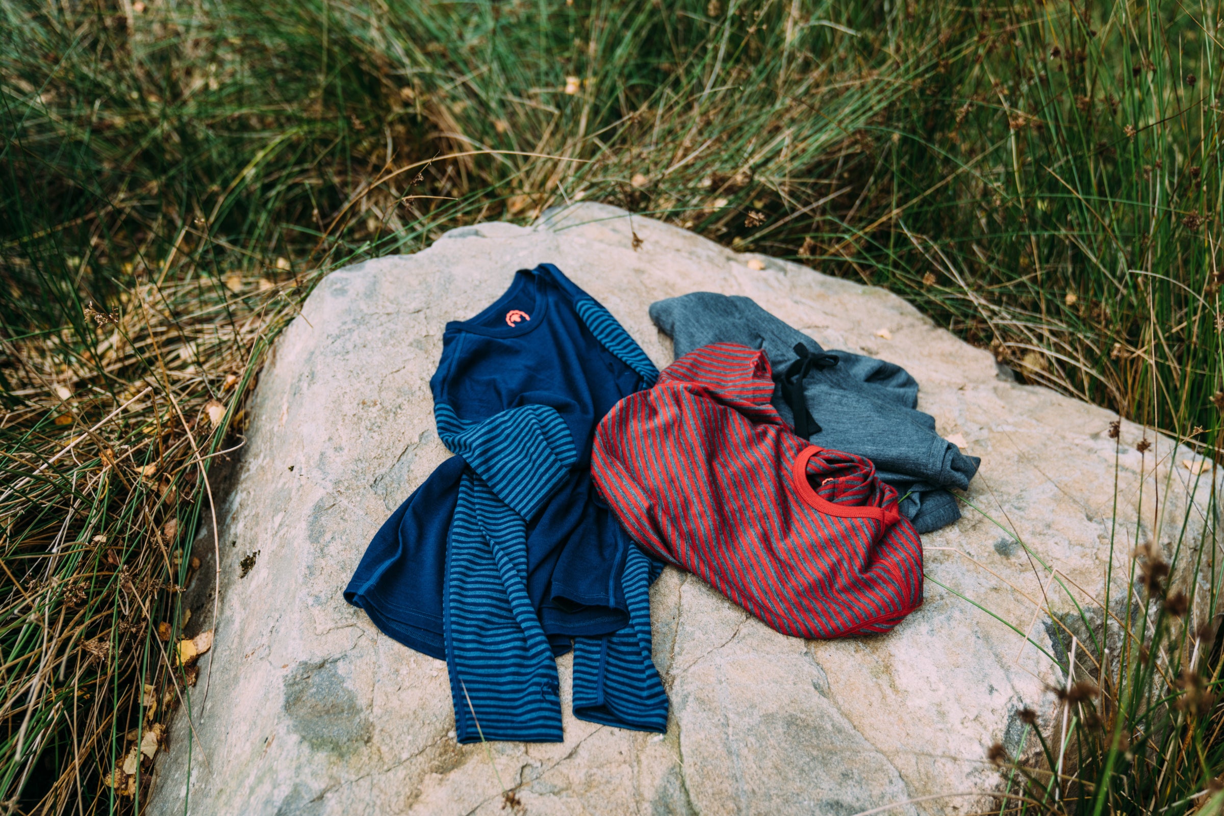 Isobaa Merino Wool Garments on a rock