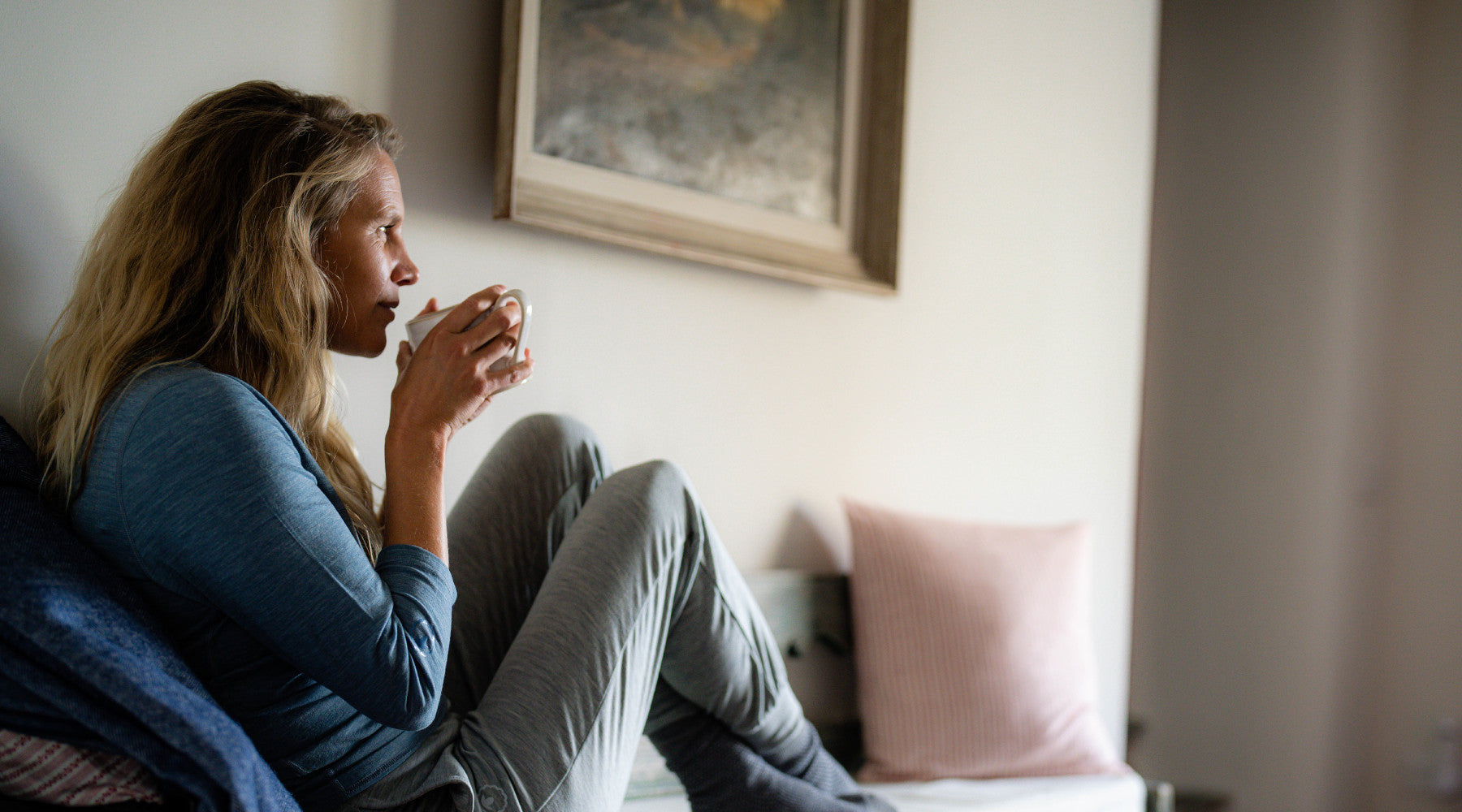 Isobaa Womens 160 PJ Henley and 200 PJ Joggers - enjoying a warm cup of tea on the couch