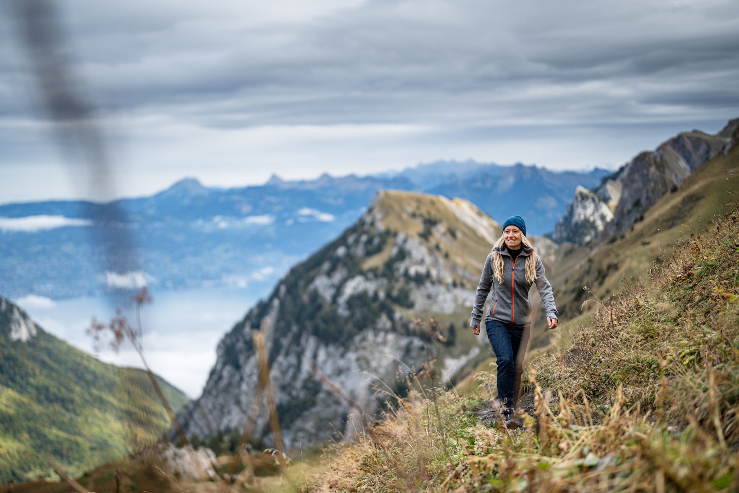 Woman hiking along a mountain ridge