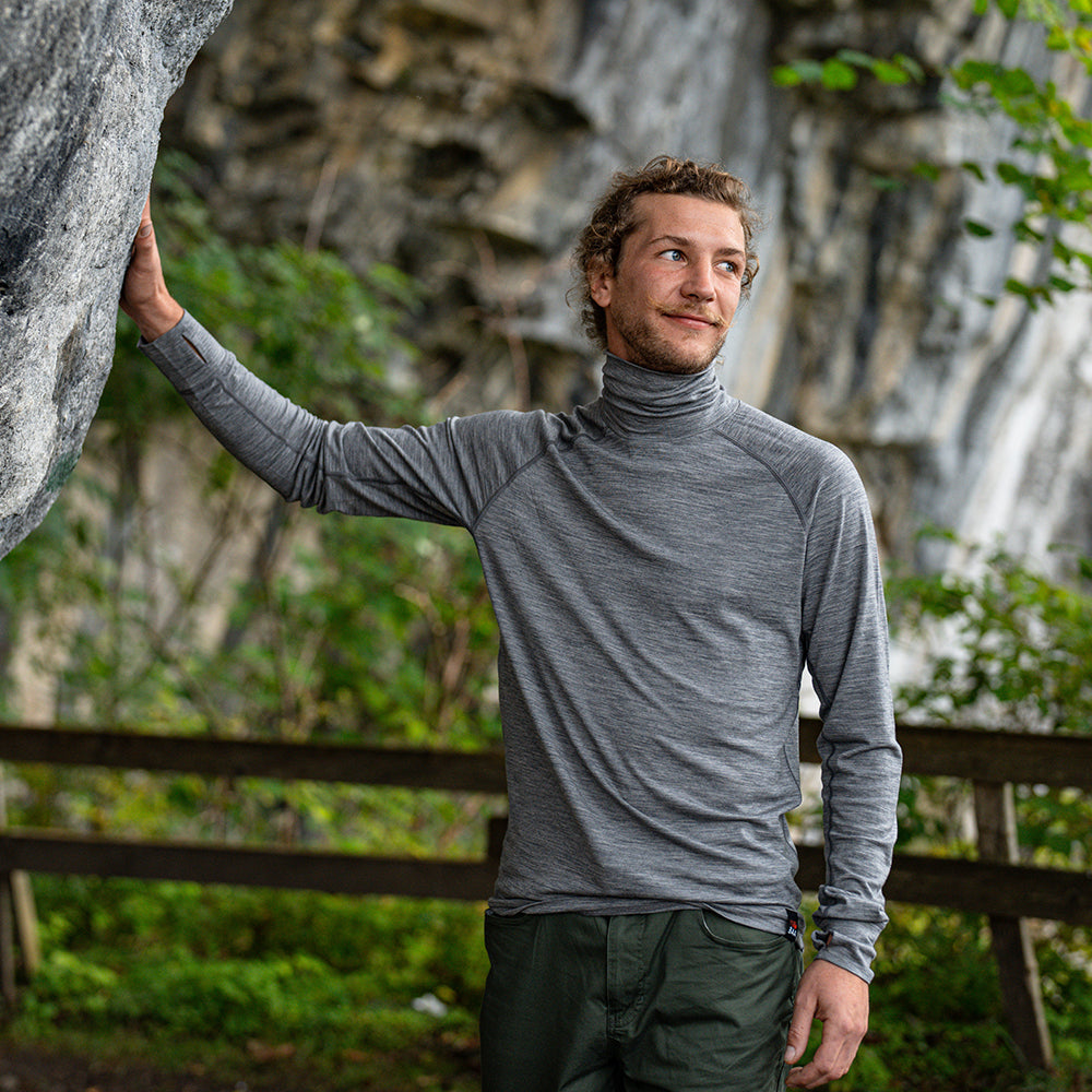 Isobaa | Mens 160 Merino Active Roll Neck (Charcoal Melange) | Embrace the chill in style with our Men's 160 Merino Active Roll Neck, crafted from 160g 18.5 micron superfine merino wool | Model: Baudoin