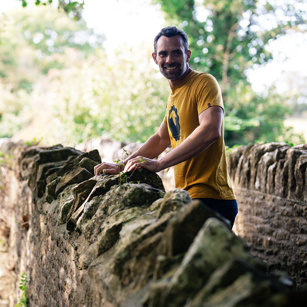 Isobaa | Mens Merino 150 Emblem Tee (Mustard/Navy) | Conquer trails and city streets in comfort with Isobaa's superfine Merino T-Shirt.