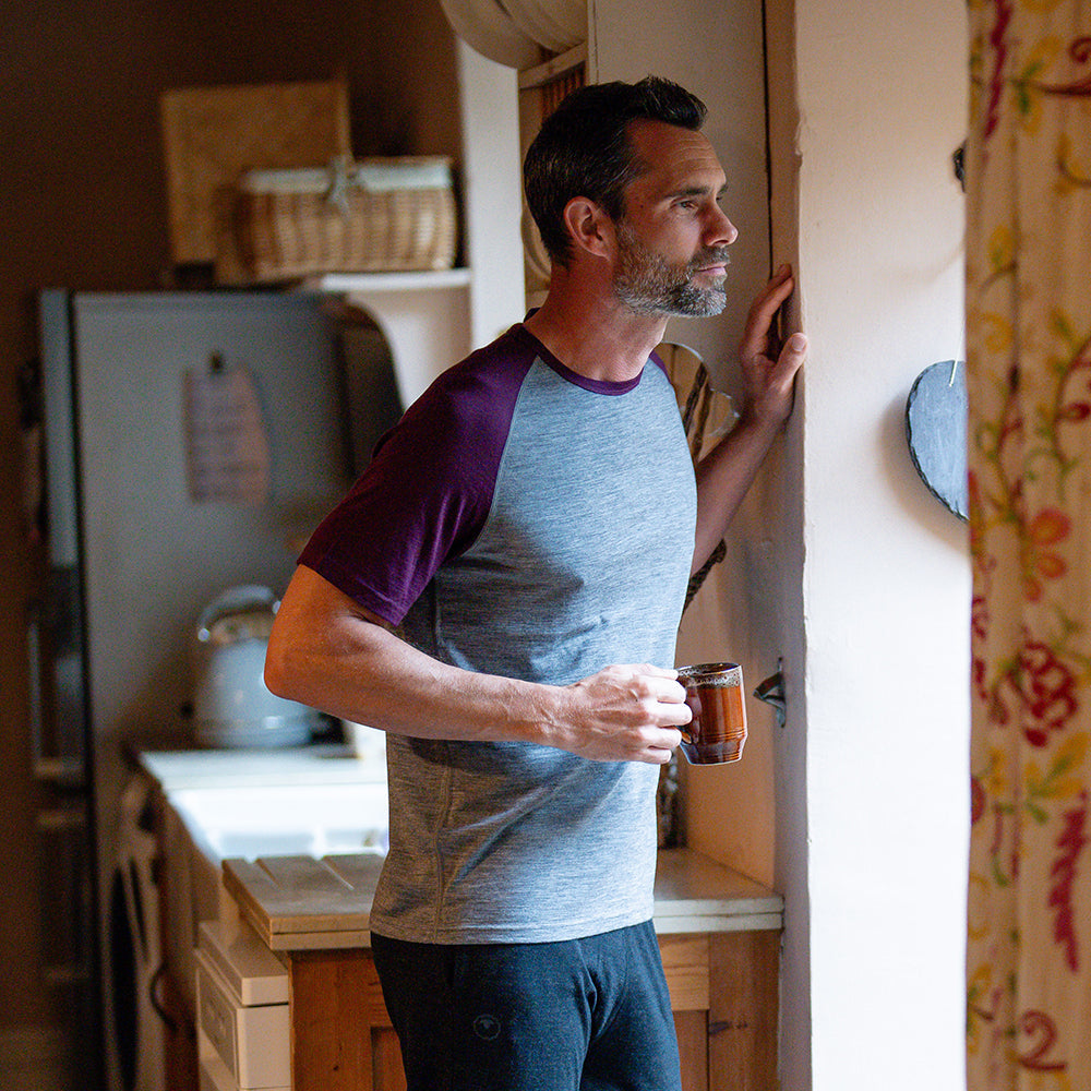 Isobaa | Mens Merino 150 Raglan Baseball Tee (Charcoal/Wine) | Layer for adventure with Isobaa's superfine Merino Tee. | Model: Ben