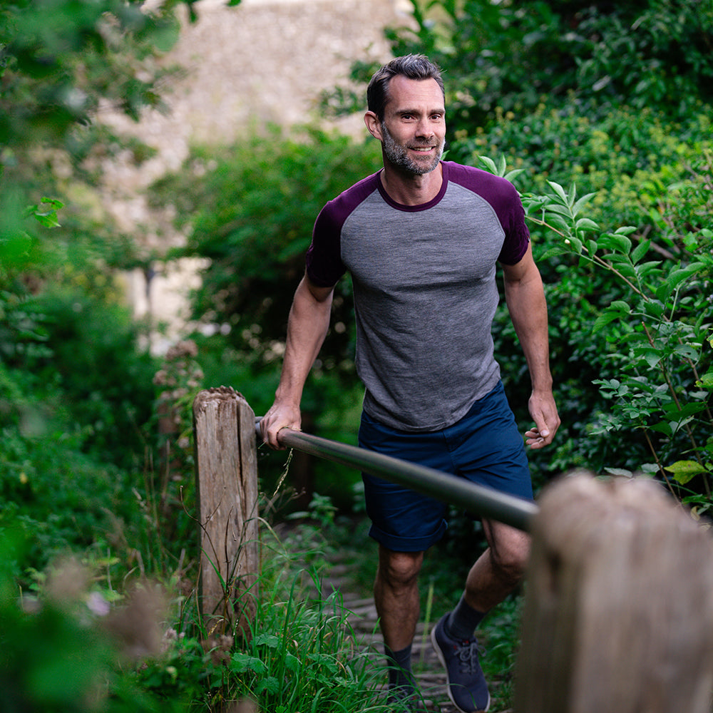 Isobaa | Mens Merino 150 Raglan Baseball Tee (Charcoal/Wine) | Layer for adventure with Isobaa's superfine Merino Tee. | Model: Ben
