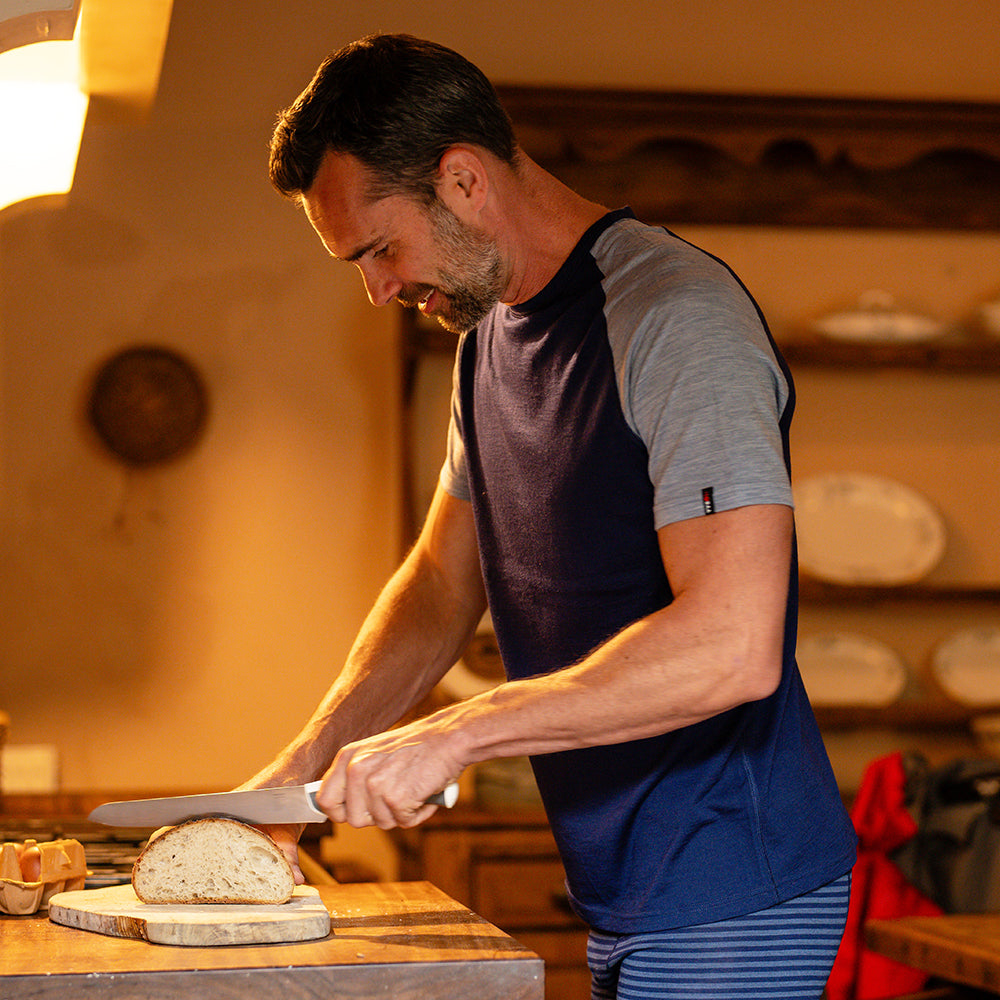 Isobaa | Mens Merino 150 Raglan Baseball Tee (Navy/Sky) | Layer for adventure with Isobaa's superfine Merino Tee. | Model: Ben