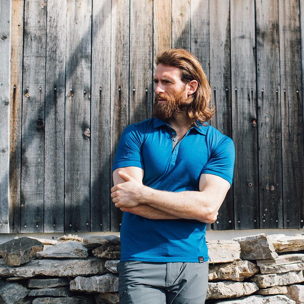 Isobaa | Mens Merino 180 Short Sleeve Polo Shirt (Black) | The ultimate Merino wool polo — perfect for weekend hikes, bike commutes, post-adventure coffee stops, office days, and everything in-between. | Model: Craig