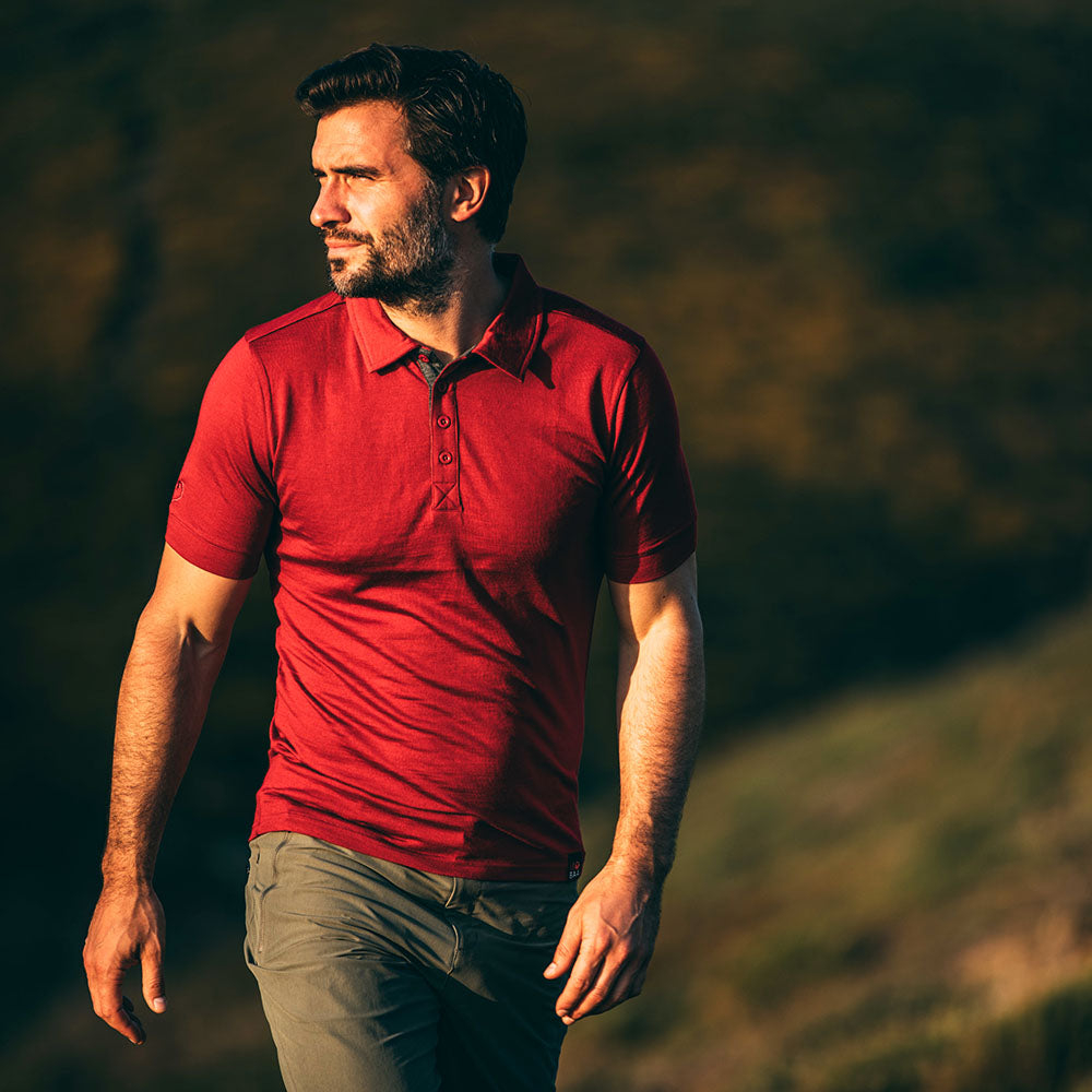 Isobaa | Mens Merino 180 Short Sleeve Polo Shirt (Black) | The ultimate Merino wool polo — perfect for weekend hikes, bike commutes, post-adventure coffee stops, office days, and everything in-between. | Model: Duncan