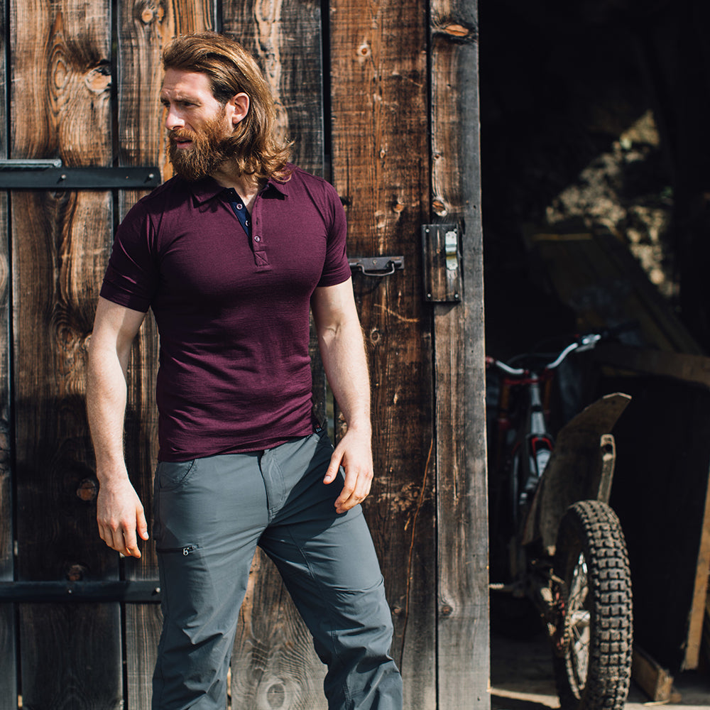 Isobaa | Mens Merino 180 Short Sleeve Polo Shirt (Black) | The ultimate Merino wool polo — perfect for weekend hikes, bike commutes, post-adventure coffee stops, office days, and everything in-between. | Model: Craig