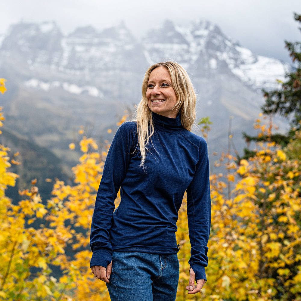 Isobaa | Womens 160 Merino Active Roll Neck (Navy) | Embrace the chill in style with our Women's 160 Merino Active Roll Neck, crafted from 160g 18.5 micron superfine merino wool | Model: Estelle