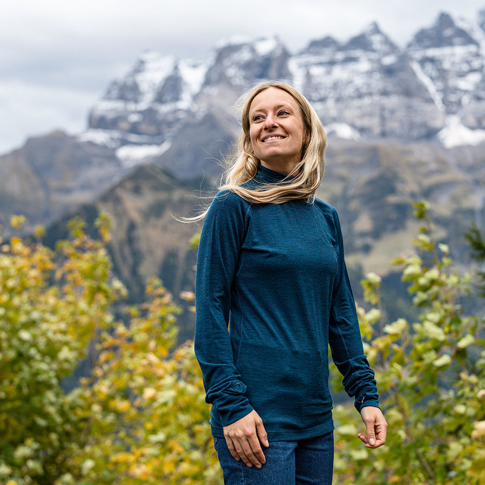 Isobaa | Womens 160 Merino Active Roll Neck (Petrol) | Embrace the chill in style with our Women's 160 Merino Active Roll Neck, crafted from 160g 18.5 micron superfine merino wool | Model: Estelle