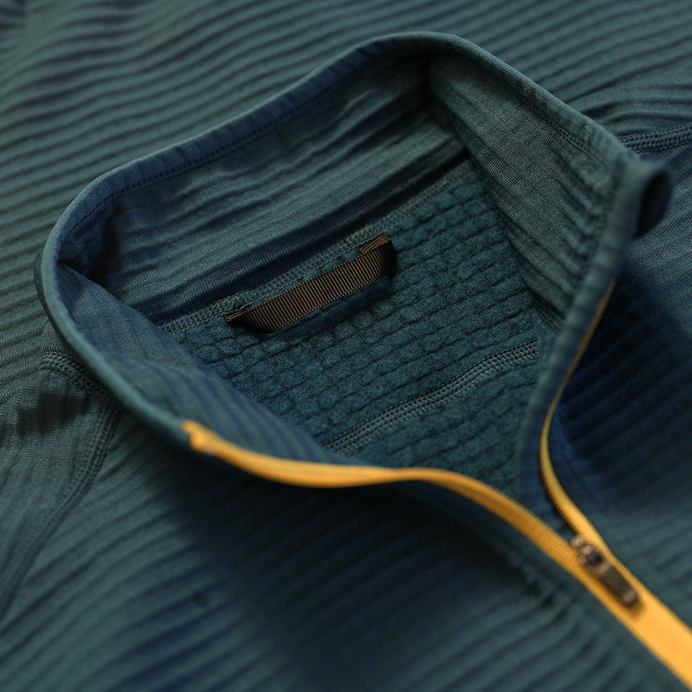Isobaa | Womens 260 Merino Blend Grid Fleece (Petrol) | Stay warm and comfortable during your cold-weather activities with the 260 Merino Blend Grid Fleece Half Zip