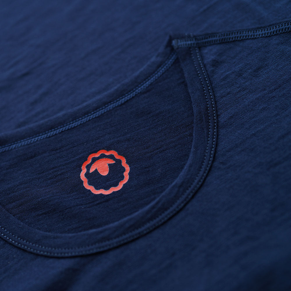 Isobaa | Womens Merino 150 Emblem Tee (Navy/Orange) | Conquer trails and city streets in comfort with Isobaa's superfine Merino T-Shirt.