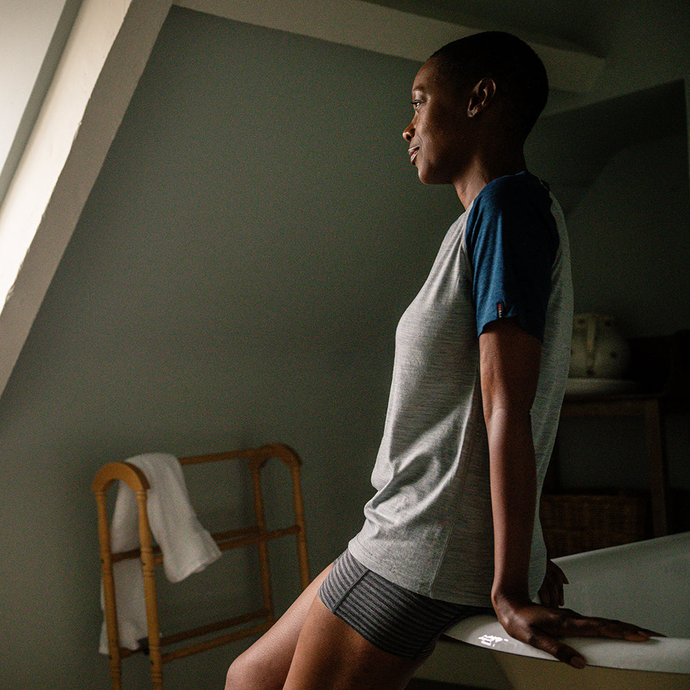 Isobaa | Womens Merino 150 Raglan Baseball Tee (Cloud/Petrol) | Layer for adventure with Isobaa's superfine Merino Tee. | Model: Yolisa