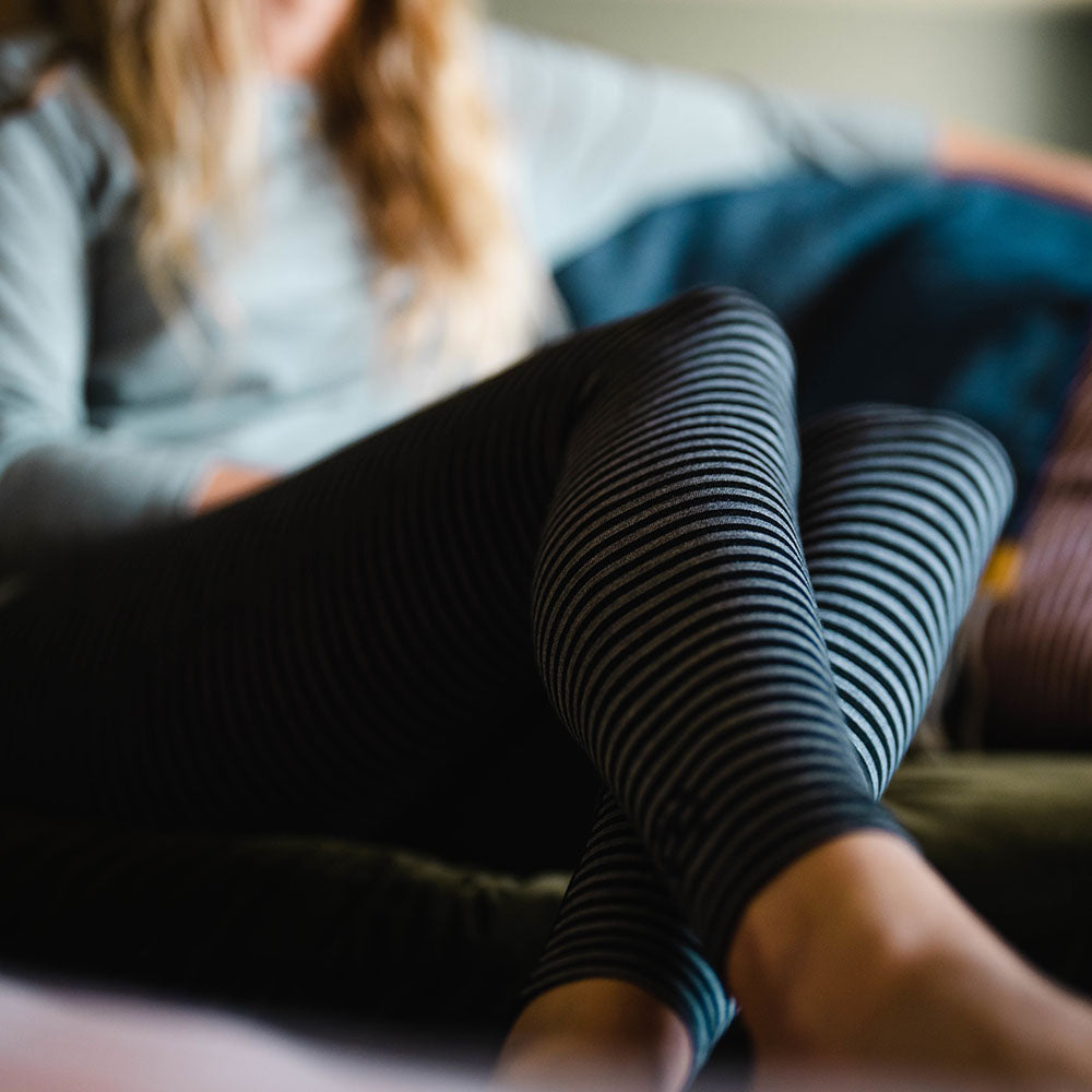 Isobaa | Womens Merino 200 Tights (Black/Charcoal) | Conquer mountains, ski slopes, and sofa days with unmatched comfort in our 200gm Merino wool tights. | Model: Amy