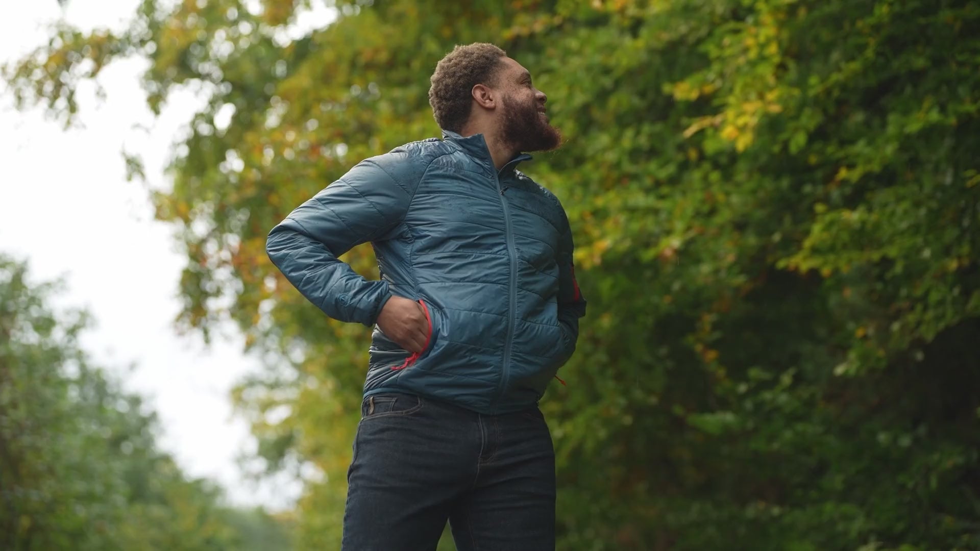 Isobaa | Mens Packable Insulated Jacket (Petrol/Orange) | Exceptional warmth, packable convenience, and sustainable design with our lightweight Merino wool jacket. | align: 45% 40% | Model: Shaquille