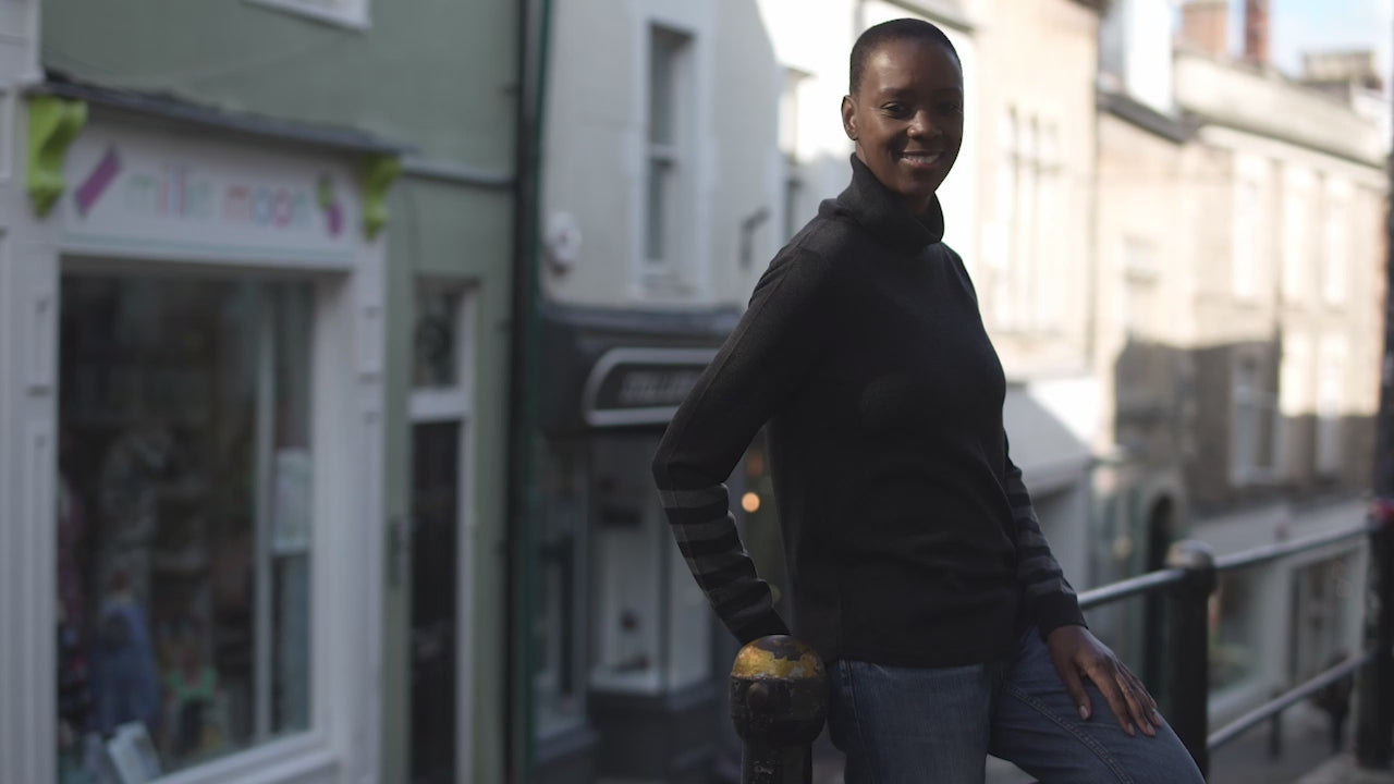 Isobaa | Womens Merino Roll Neck Sweater (Black/Smoke) | Discover premium style and performance with Isobaa's extra-fine Merino roll neck sweater. | align: 65% 50% | Model: Yolisa