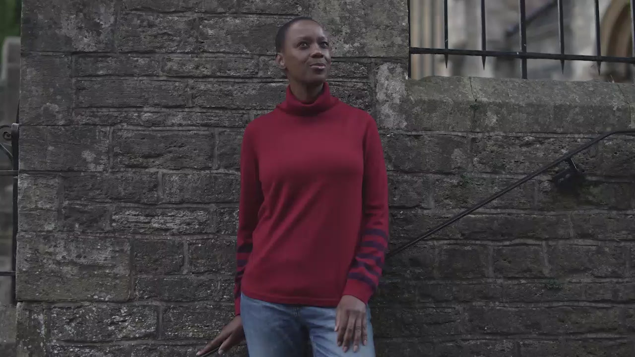 Isobaa | Womens Merino Roll Neck Sweater (Red/Wine) | Discover premium style and performance with Isobaa's extra-fine Merino roll neck sweater. | align: 45% 50% | Model: Yolisa