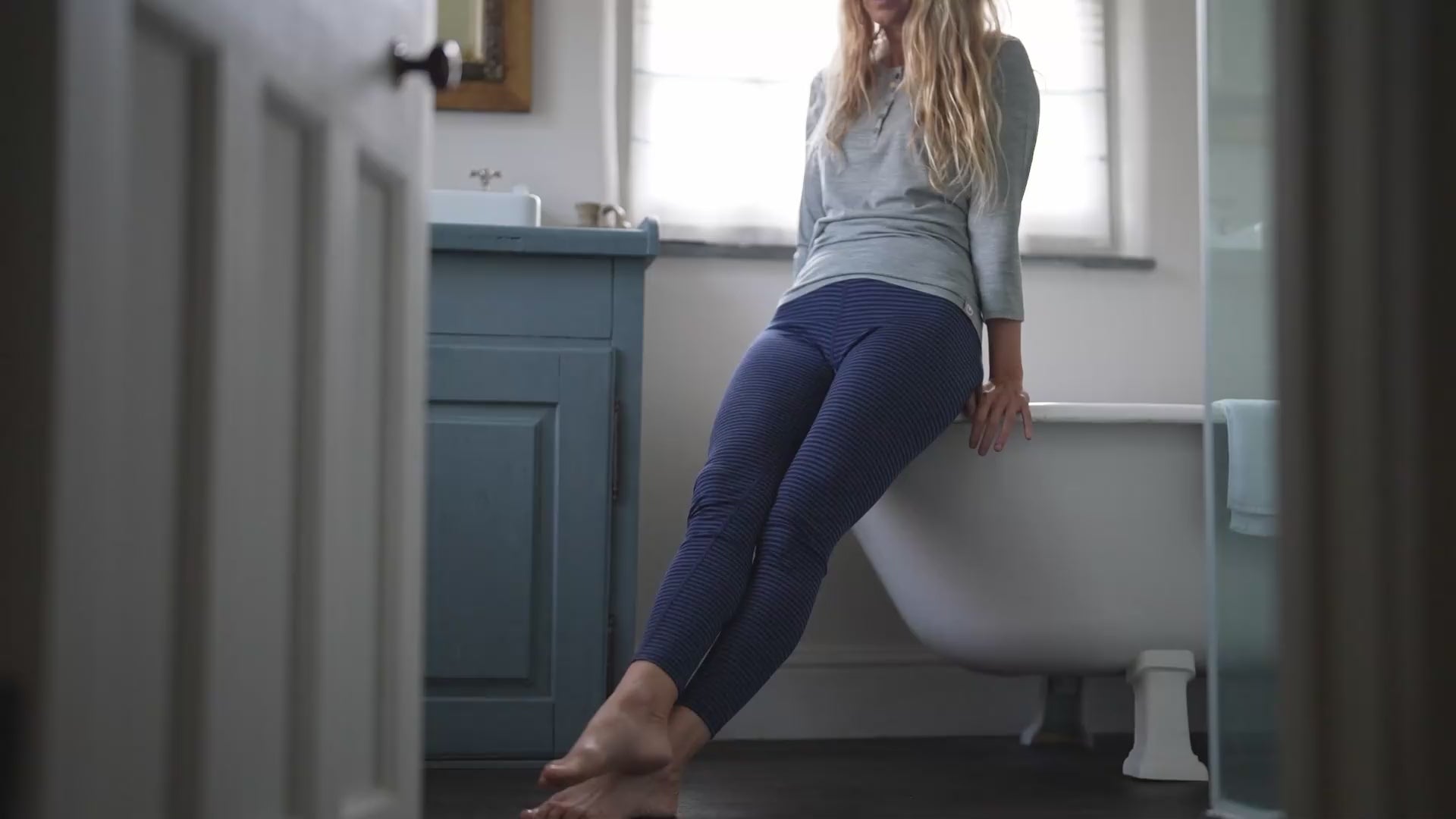 Isobaa | Womens Merino 200 Tights (Navy/Denim) | Conquer mountains, ski slopes, and sofa days with unmatched comfort in our 200gm Merino wool tights. | align: 55% 80% | Model: Amy