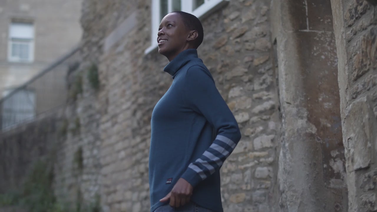 Isobaa | Womens Merino Roll Neck Sweater (Petrol/Sky) | Discover premium style and performance with Isobaa's extra-fine Merino roll neck sweater. | align: 45% 50% | Model: Yolisa