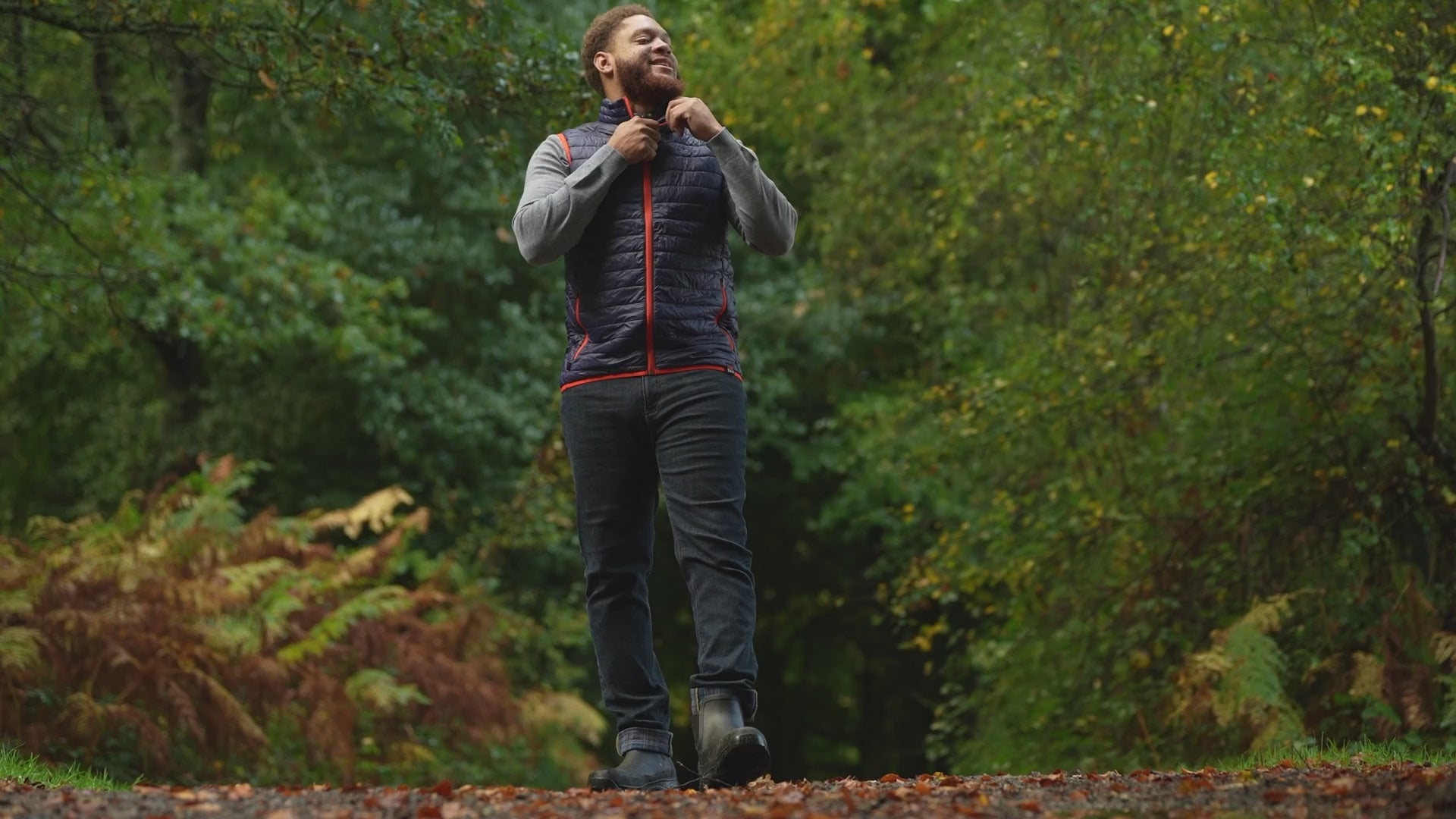 Isobaa | Mens Merino Wool Insulated Gilet (Navy/Orange) | Fight the chill with our innovative Merino gilet. | align: 50% 40% | Model: Shaquille