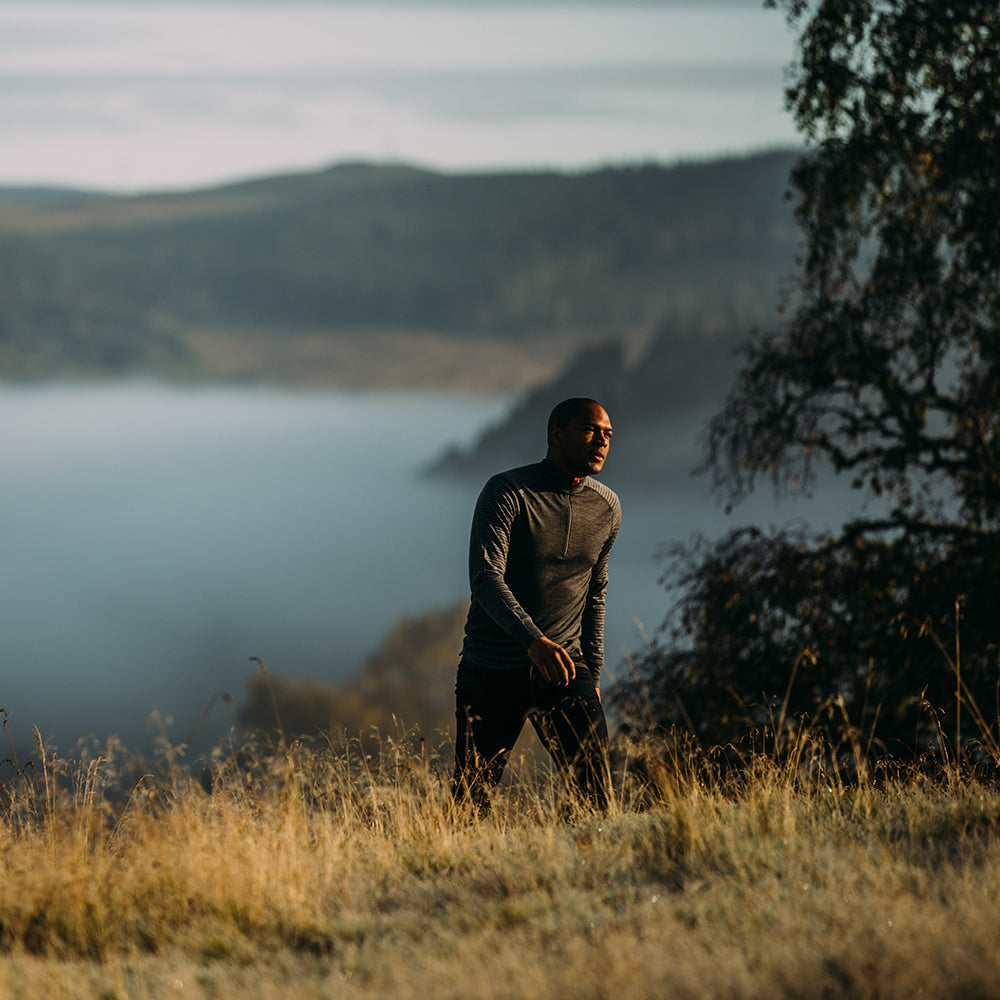 Isobaa | Mens Merino 200 Long Sleeve Zip Neck (Stripe Smoke/Charcoal) | Experience the best of 200gm Merino wool with this ultimate half-zip top – your go-to for challenging hikes, chilly bike commutes, post-workout layering, and unpredictable weather. | Model: Edirin