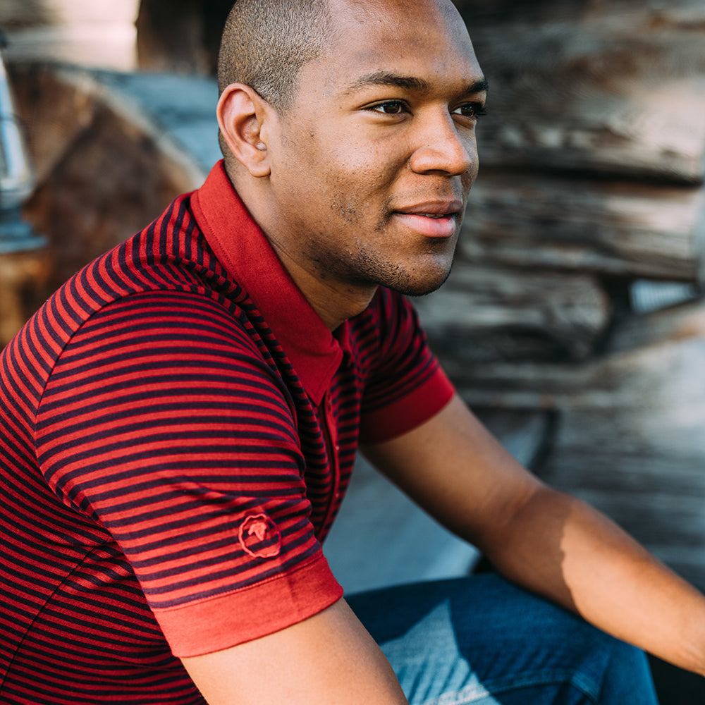 Isobaa | Mens Merino 180 Short Sleeve Polo Shirt (Stripe Red/Wine) | The ultimate Merino wool polo – perfect for weekend hikes, bike commutes, post-adventure coffee stops, office days, and everything in-between. | Model: Edirin