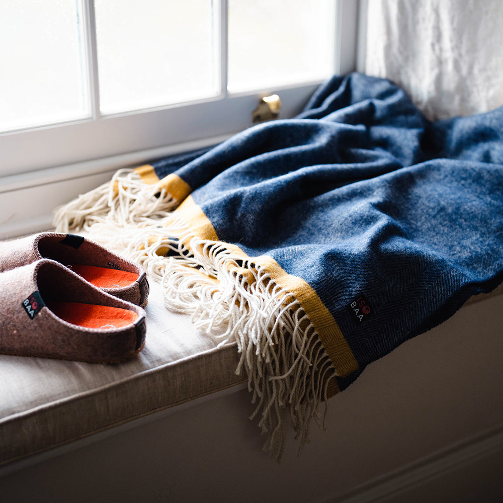 Isobaa | Merino Herringbone Throw (Navy/Mustard Stripe) | Wrap yourself in pure comfort with Isobaa's super-soft Merino throw.