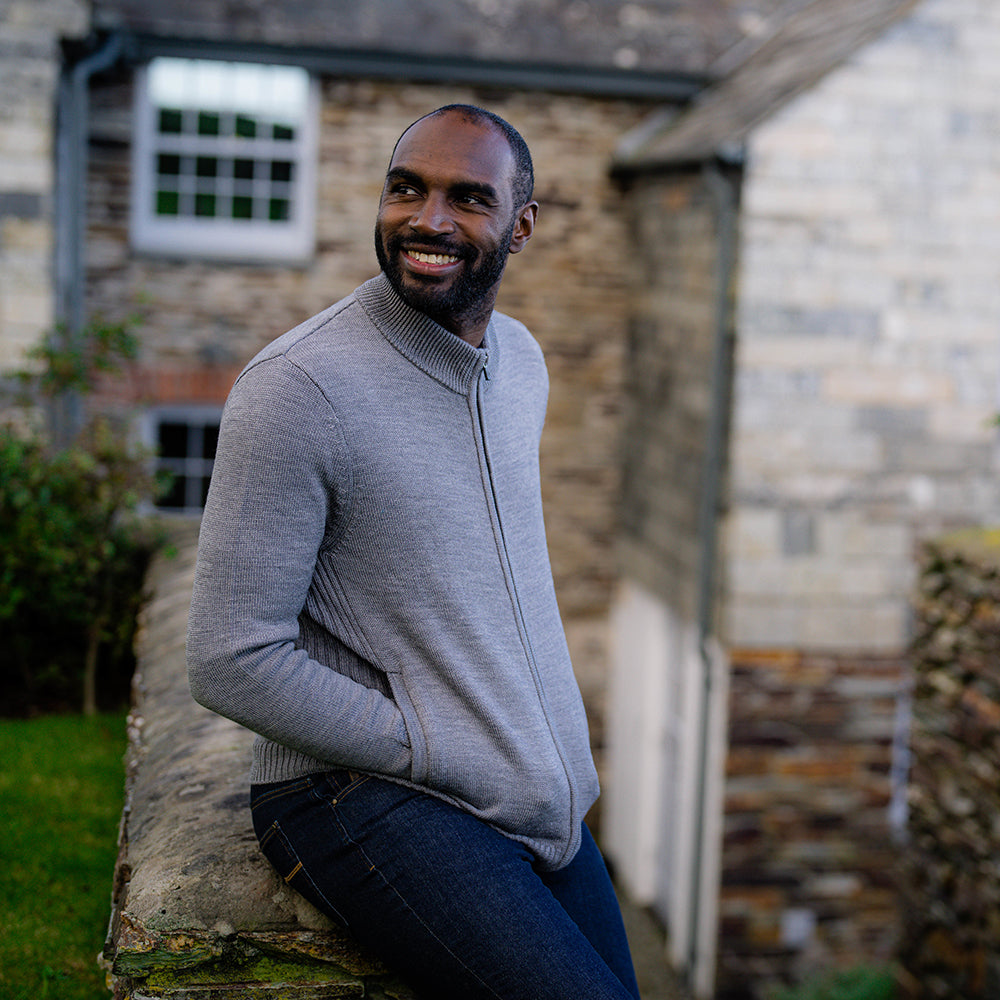 Isobaa | Mens Merino Zip Sweater (Charcoal Melange) | Discover exceptional warmth, comfort, and everyday versatility with our extrafine Merino wool sweater. | Model: Michael