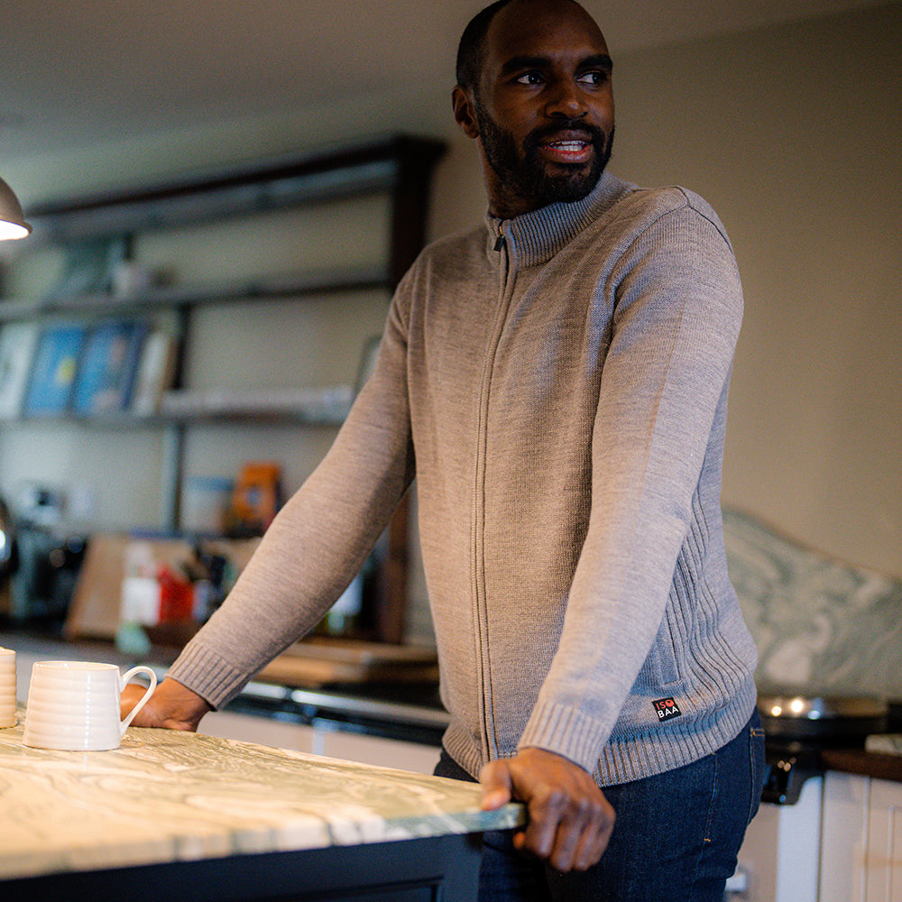 Isobaa | Mens Merino Zip Sweater (Charcoal Melange) | Discover exceptional warmth, comfort, and everyday versatility with our extrafine Merino wool sweater. | Model: Michael