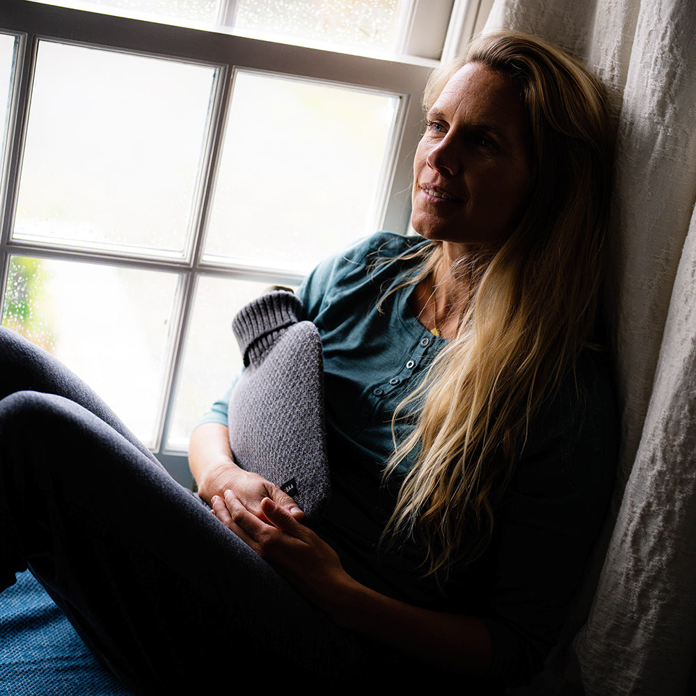 Isobaa | Merino Jacquard Hot Water Bottle Cover (Charcoal/Smoke) | Say goodbye to ordinary hot water bottles! You'll love the luxurious feel of our Merino wool cover – and your skin will thank you! Wrap yourself in cosy warmth, enjoy natural breathability, and discover the ultimate hot water bottle indulgence.