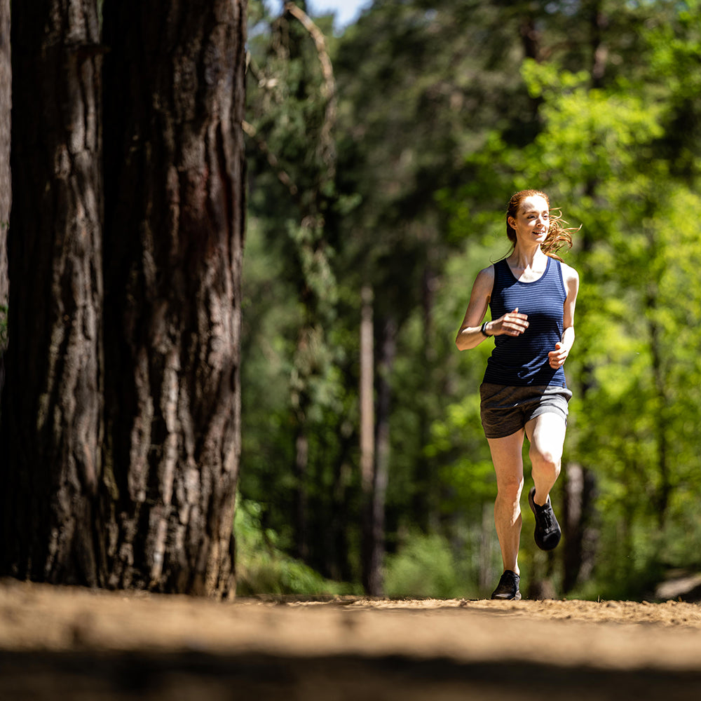 Isobaa | Womens Merino 150 Vest (Mini Stripe Navy/Denim) | Be ready for any adventure with Isobaa's superfine Merino sleeveless Vest. | Model: Sophie