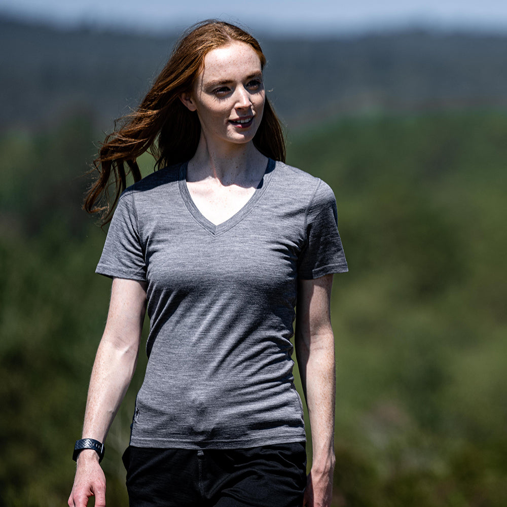 Isobaa | Womens Merino 150 V-Neck Tee (Charcoal) | Embark on new adventures with Isobaa's superfine Merino V-neck Tee. | Model: Sophie