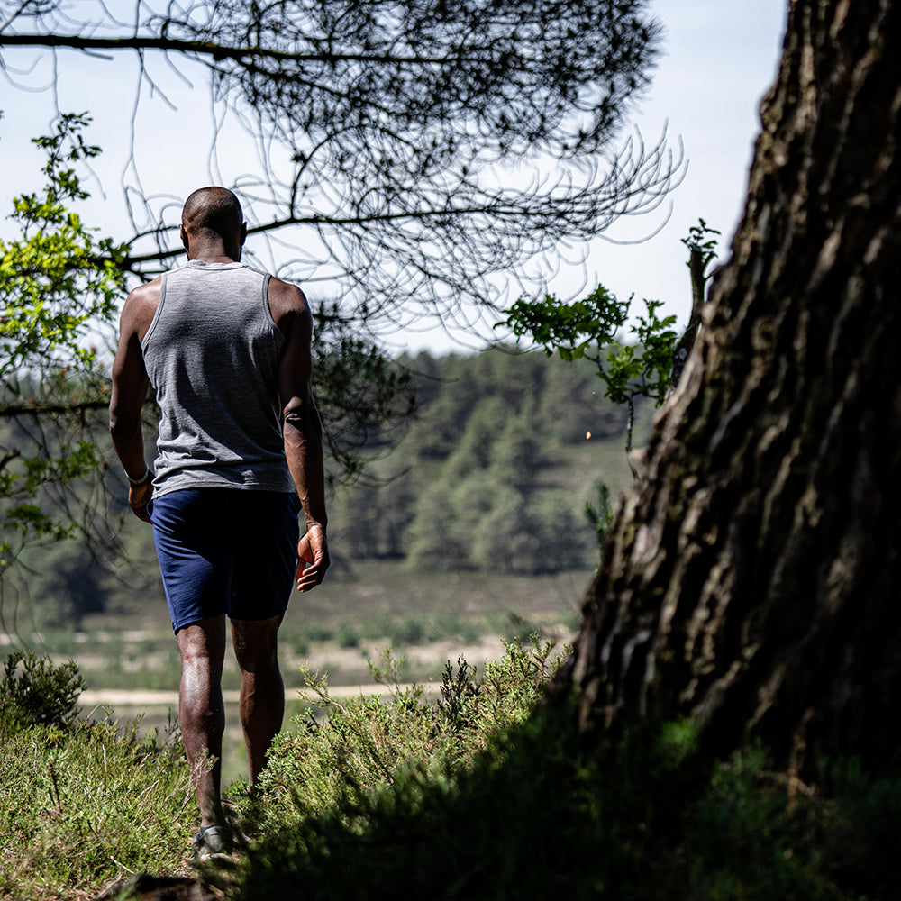 Isobaa | Mens Merino 150 Vest (Charcoal) | Be ready for any adventure with Isobaa's superfine Merino sleeveless Vest. | Model: Michael