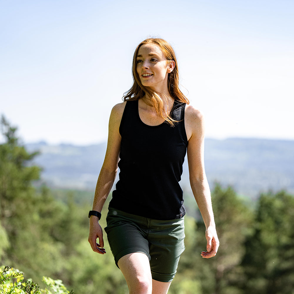 Isobaa | Womens Merino 150 Vest (Black) | Be ready for any adventure with Isobaa's superfine Merino sleeveless Vest. | Model: Sophie