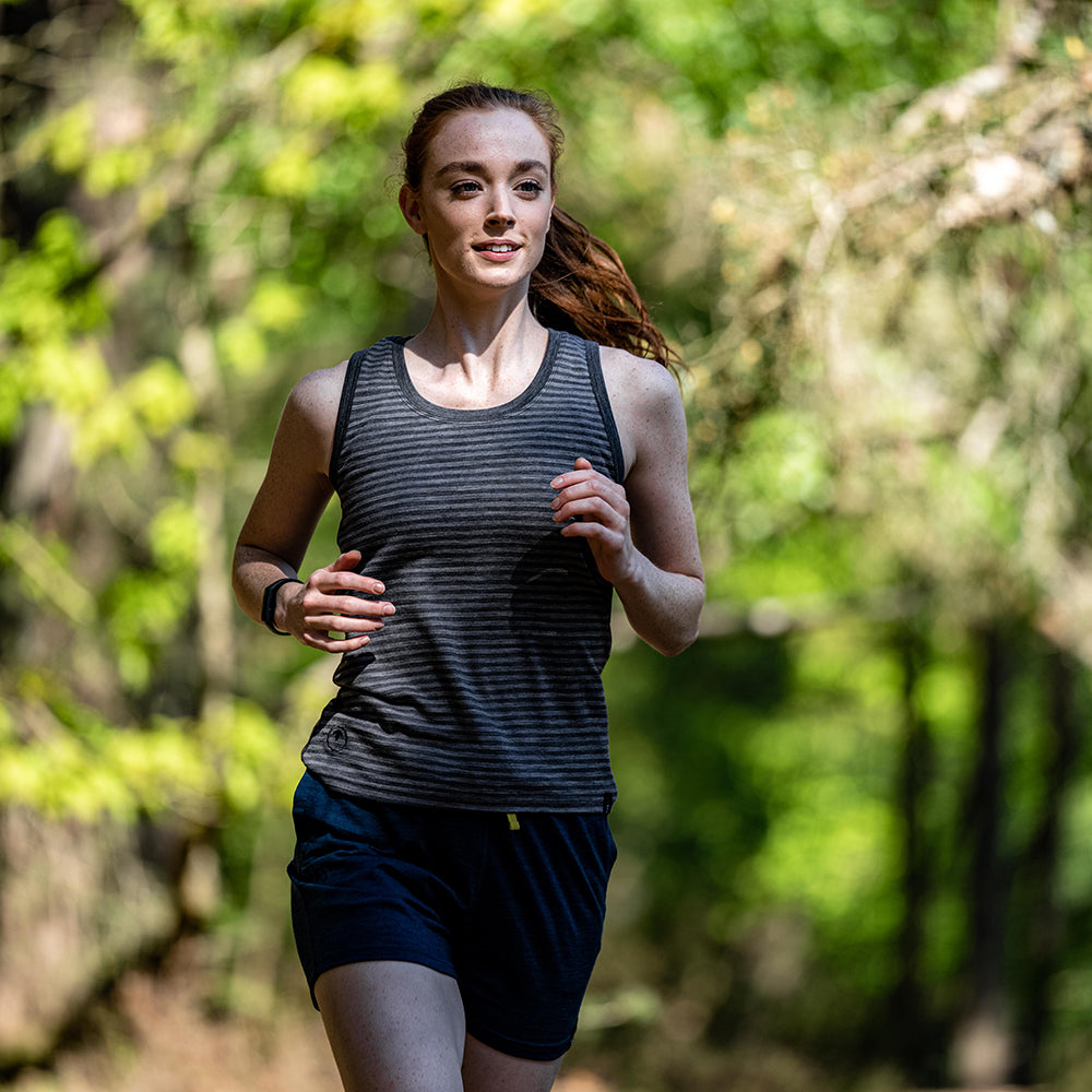 Isobaa | Womens Merino 150 Vest (Mini Stripe Smoke/Charcoal) | Be ready for any adventure with Isobaa's superfine Merino sleeveless Vest. | Model: Sophie