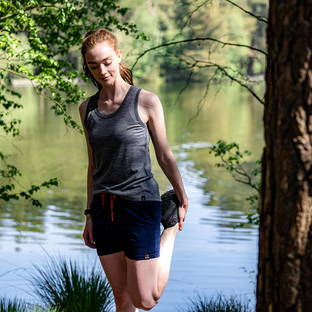 Isobaa | Womens Merino 150 Vest (Charcoal) | Be ready for any adventure with Isobaa's superfine Merino sleeveless Vest. | Model: Sophie