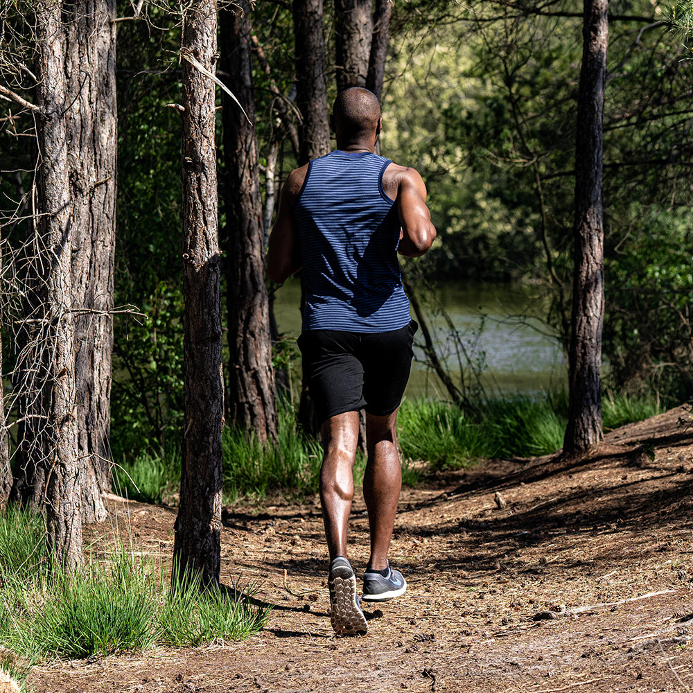 Isobaa | Mens Merino 150 Vest (Mini Stripe Navy/Denim) | Be ready for any adventure with Isobaa's superfine Merino sleeveless Vest. | Model: Michael
