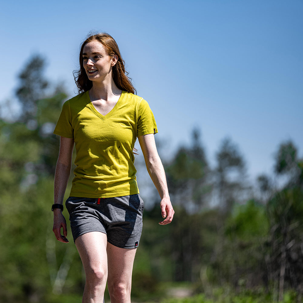 Isobaa | Womens Merino 150 V-Neck Tee (Lime) | Embark on new adventures with Isobaa's superfine Merino V-neck Tee. | Model: Sophie