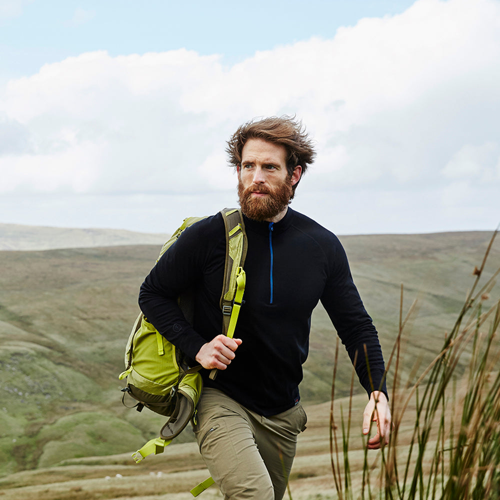 Isobaa | Mens Merino 200 Long Sleeve Zip Neck (Black) | Experience the best of 200gm Merino wool with this ultimate half-zip top – your go-to for challenging hikes, chilly bike commutes, post-workout layering, and unpredictable weather. | Model: Craig