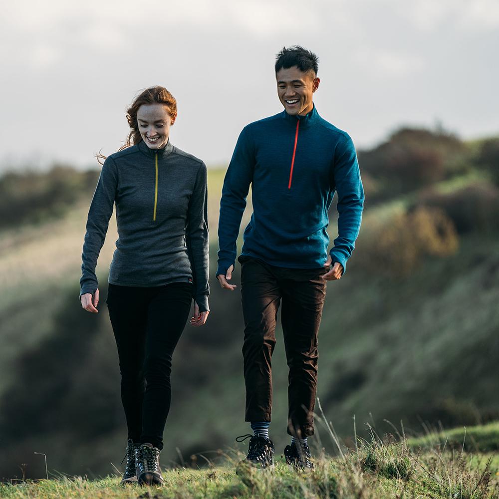 Isobaa | Mens Merino 320 Long Sleeve Half Zip (Petrol/Orange) | Conquer cold trails, blustery commutes, and unpredictable weather with the ultimate Merino wool half-zip top. | Model: Donald