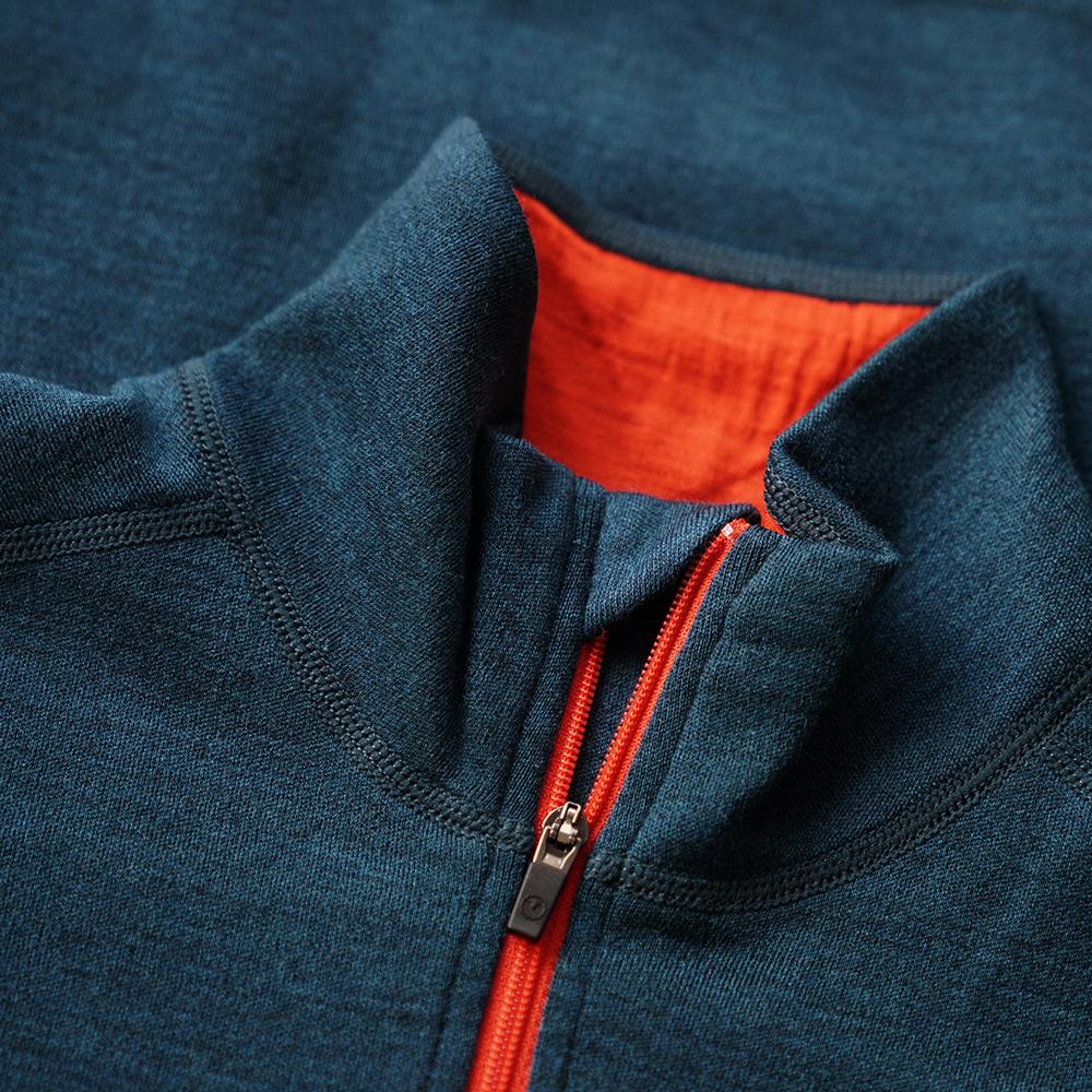 Isobaa | Mens Merino 320 Long Sleeve Half Zip (Petrol/Orange) | Conquer cold trails, blustery commutes, and unpredictable weather with the ultimate Merino wool half-zip top.