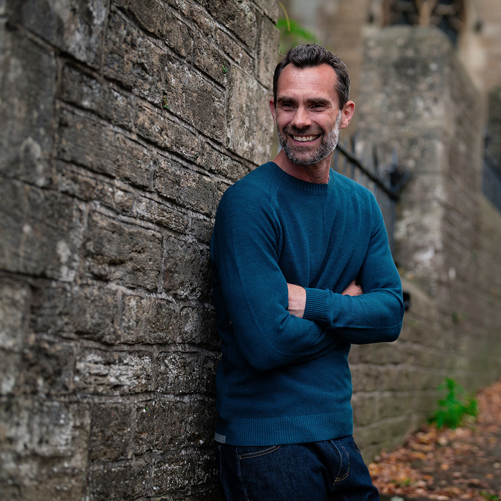 Isobaa | Mens Merino Moss Stitch Sweater (Petrol/Charcoal) | Discover timeless style and outdoor-ready comfort with our extrafine Merino wool crew neck sweater. | Model: Ben