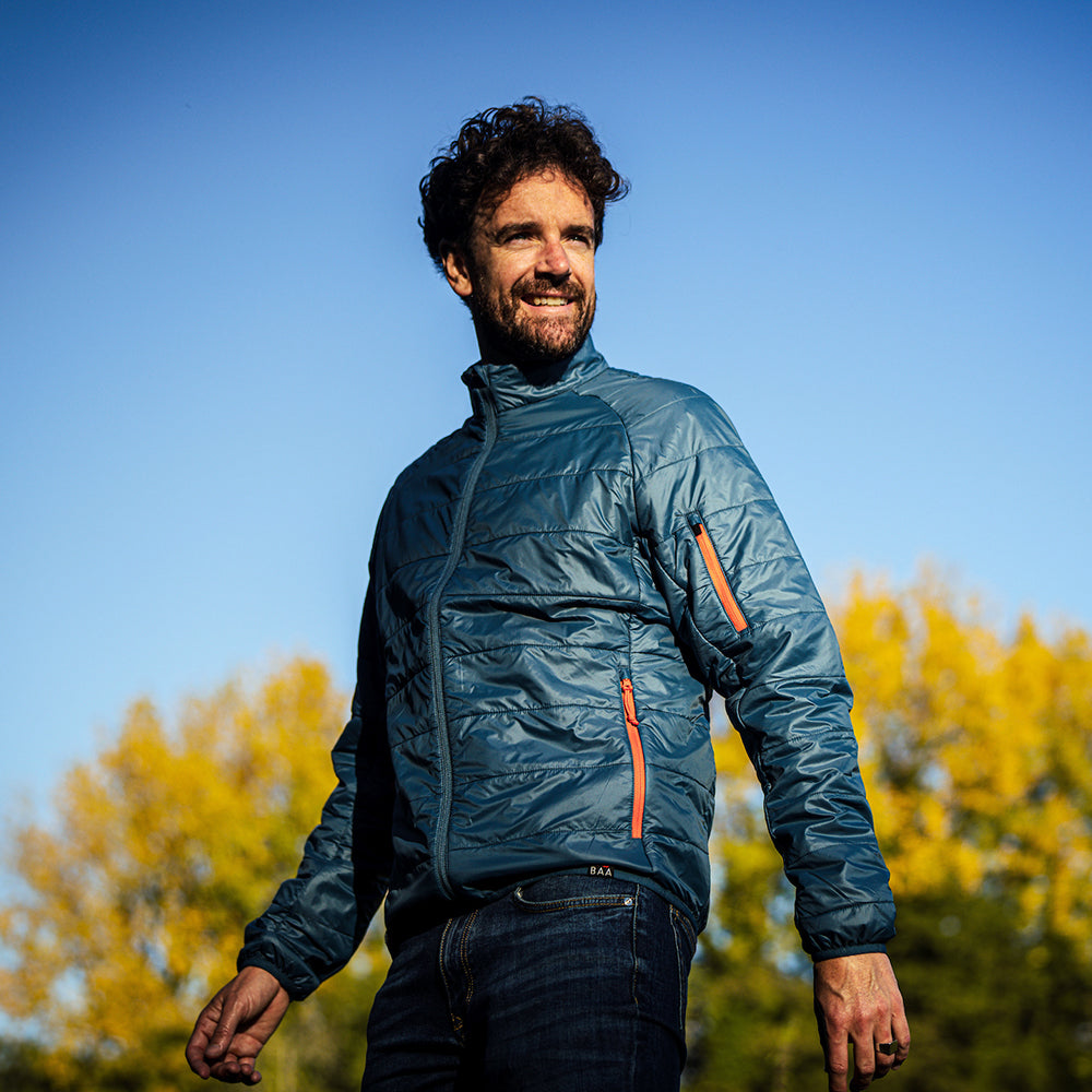 Isobaa | Mens Packable Insulated Jacket (Petrol/Orange) | Exceptional warmth, packable convenience, and sustainable design with our lightweight Merino wool jacket. | Model: Leighton