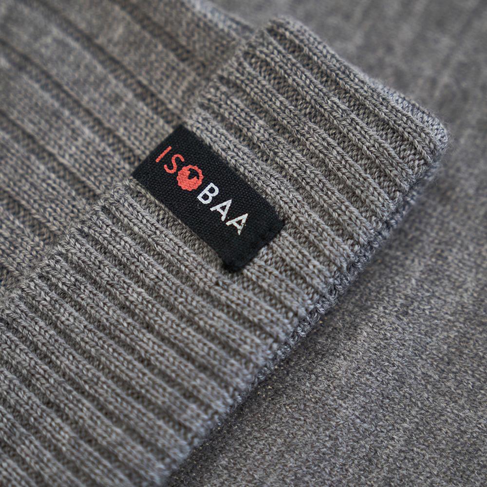 Isobaa | Merino Bobble Beanie (Charcoal/Orange) | Stay warm and stylish with Isobaa's extra-fine Merino bobble beanie! Its cosy warmth, playful bobble, and classic rib-knit design will make it your go-to winter essential for hikes, city strolls, and everything in between.