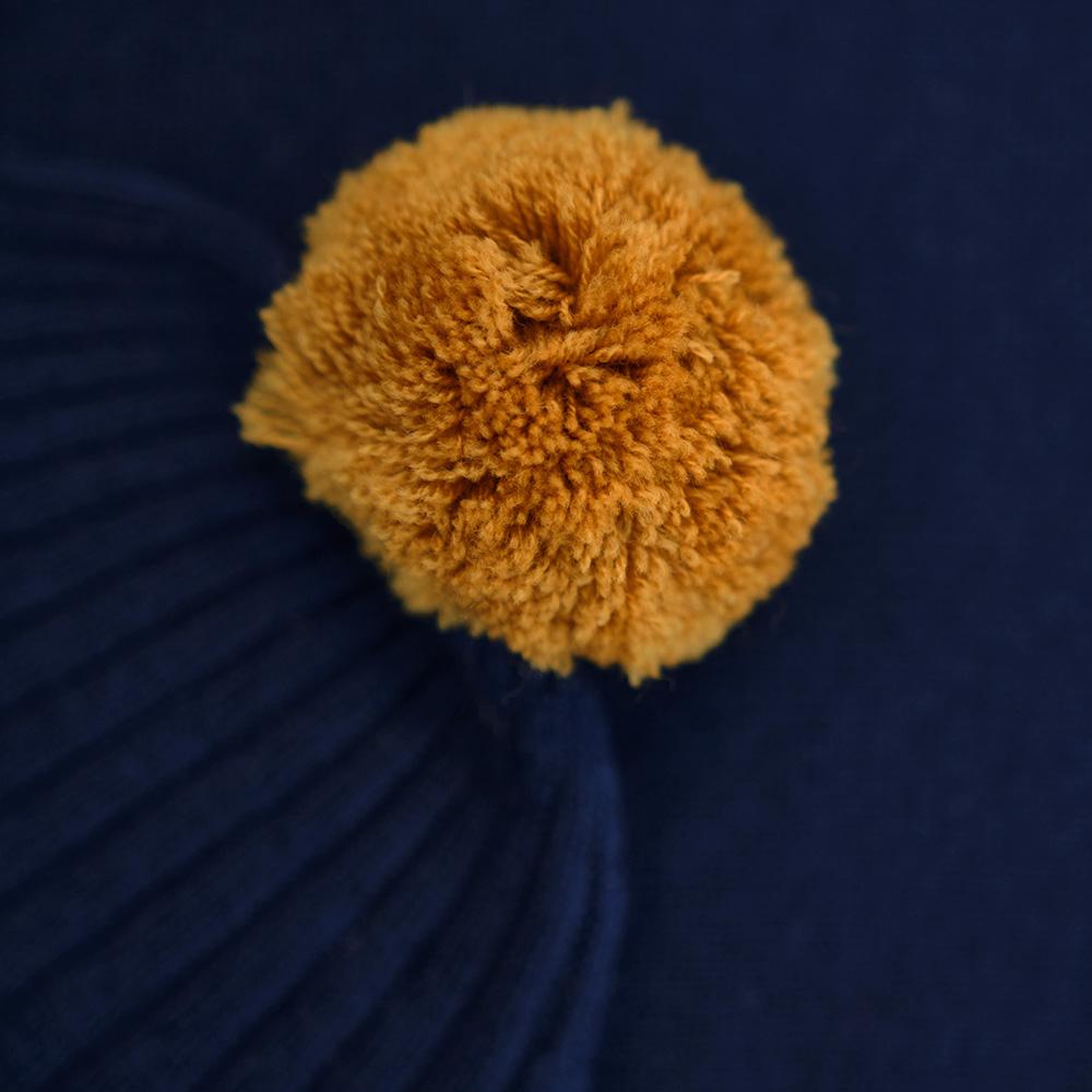 Isobaa | Merino Bobble Beanie (Navy/Mustard) | Stay warm and stylish with Isobaa's extra-fine Merino bobble beanie! Its cosy warmth, playful bobble, and classic rib-knit design will make it your go-to winter essential for hikes, city strolls, and everything in between.