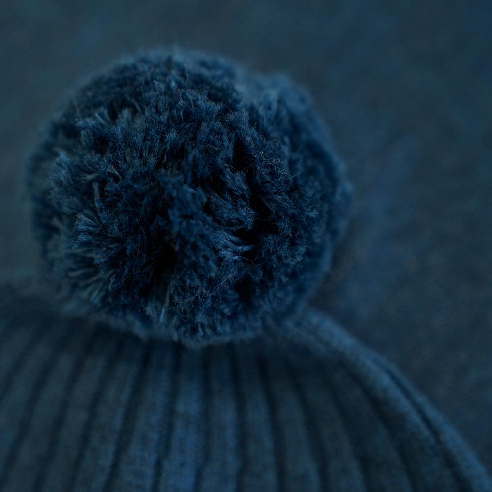 Isobaa | Merino Bobble Beanie (Petrol) | Stay warm and stylish with Isobaa's extra-fine Merino bobble beanie! Its cosy warmth, playful bobble, and classic rib-knit design will make it your go-to winter essential for hikes, city strolls, and everything in between.