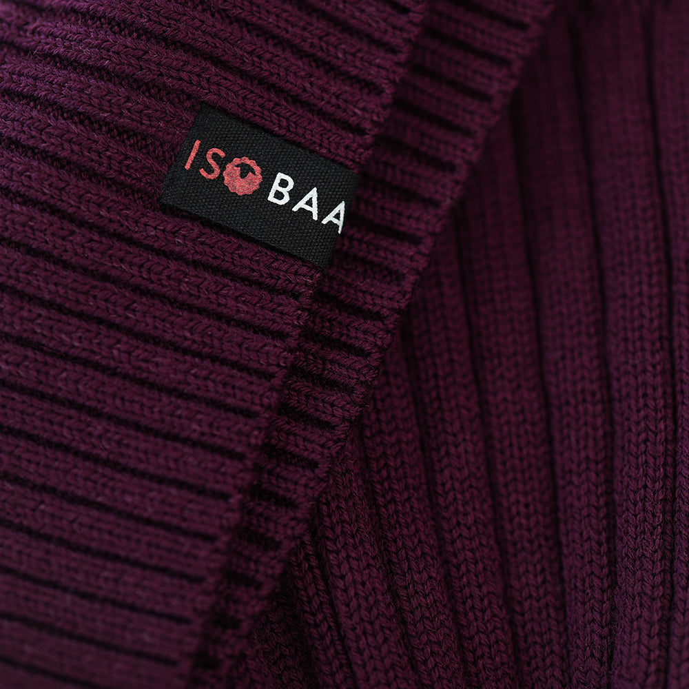 Isobaa | Merino Bobble Beanie (Wine/Fuchsia) | Stay warm and stylish with Isobaa's extra-fine Merino bobble beanie! Its cosy warmth, playful bobble, and classic rib-knit design will make it your go-to winter essential for hikes, city strolls, and everything in between.