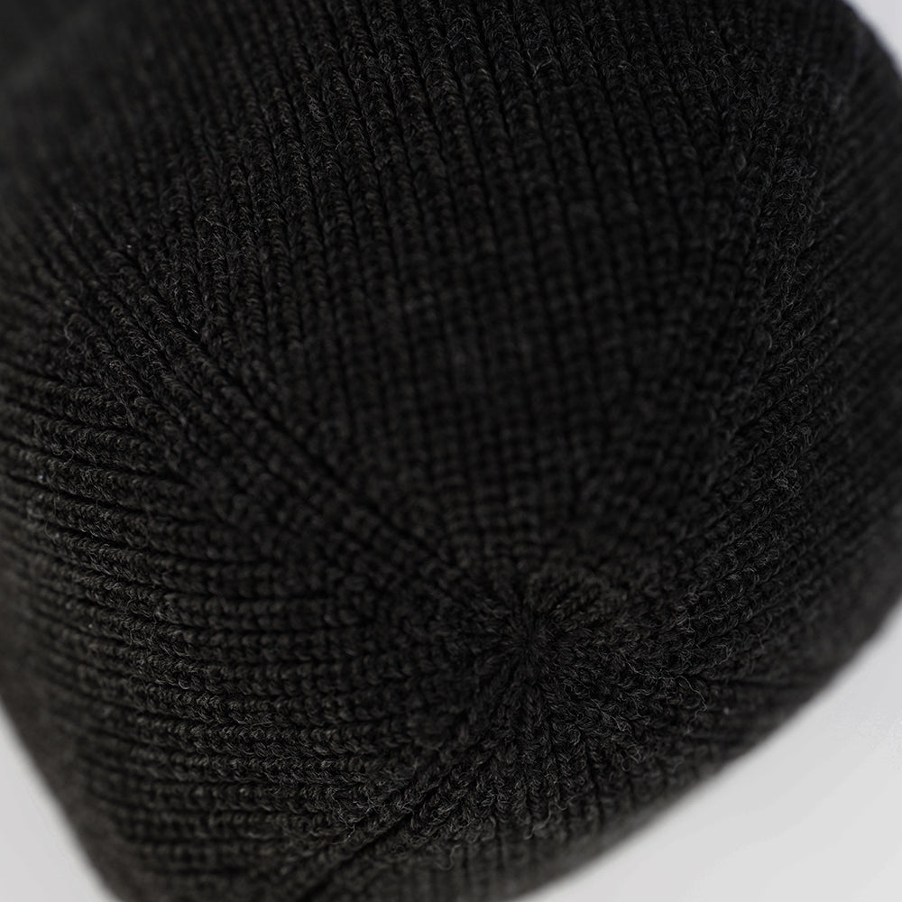 Isobaa | Merino Fisherman Beanie (Black Melange) | From mountain trails to city streets, our extra-fine Merino fisherman beanie delivers classic style and unmatched comfort.