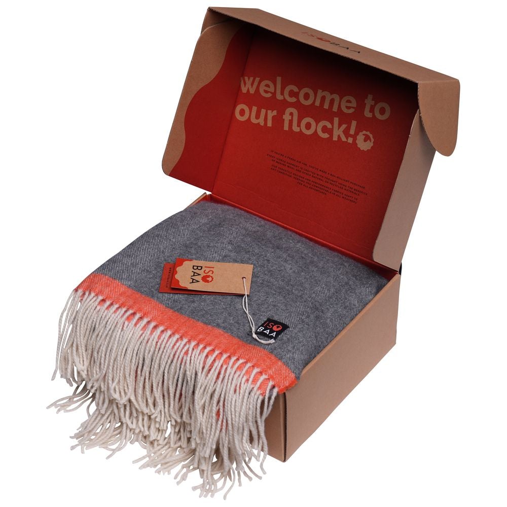 Isobaa | Merino Herringbone Throw (Charcoal/Orange Stripe) | Wrap yourself in pure comfort with Isobaa's super-soft Merino throw.