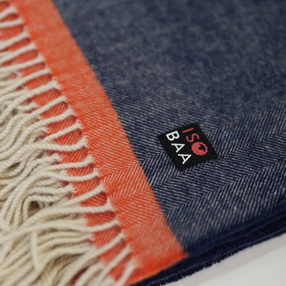Isobaa | Merino Herringbone Throw (Navy/Orange Stripe) | Wrap yourself in pure comfort with Isobaa's super-soft Merino throw.